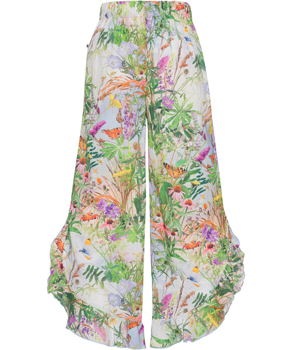 Aretha - Wild Nature - Luchtige broek van bioglosch katoen met een bloemenprint en ruches