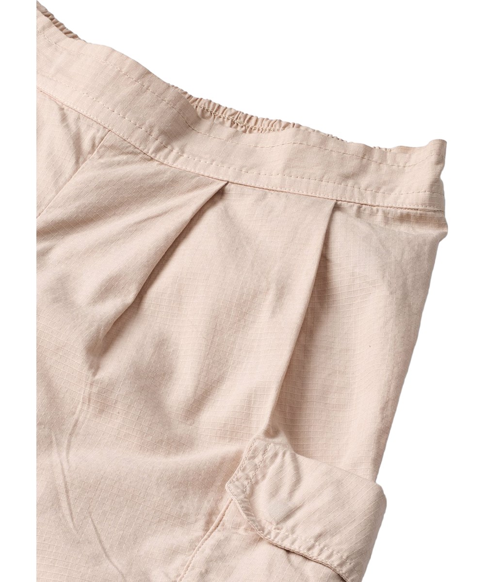 Audie - Soft Powder - Beige kinderbroek met cargozakken gemaakt van biologisch katoen 