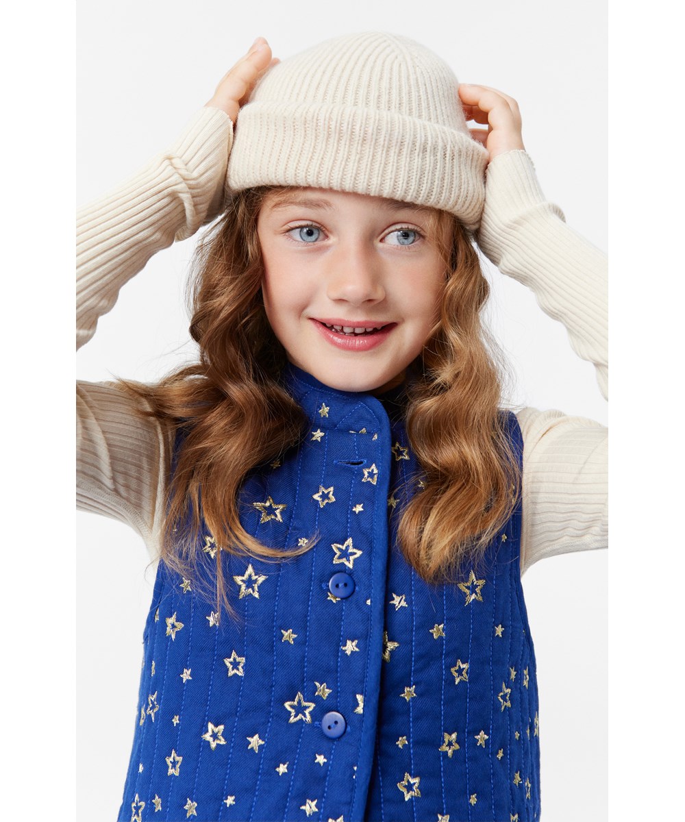 Helga - Shiny Stars - Exclusief donkerblauw gevoerde katoenen bodywarmer met opstaande kraag en gouden geborduurde sterren.