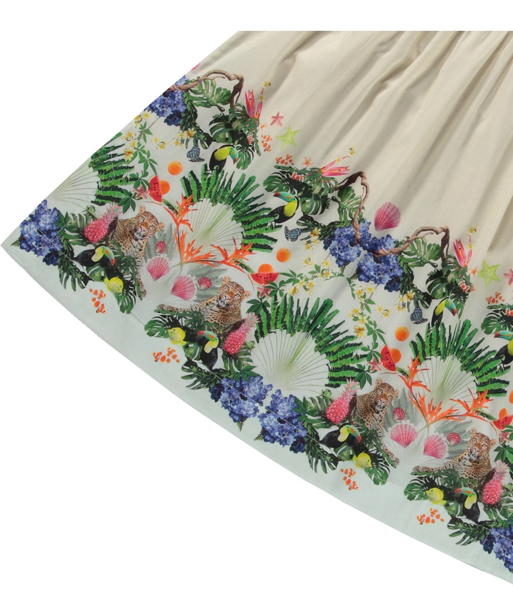 Cajla - Magic Sand - Beige ruimvallende jurk voor kinderen van biologisch katoen met brede bandjes en v-hals.