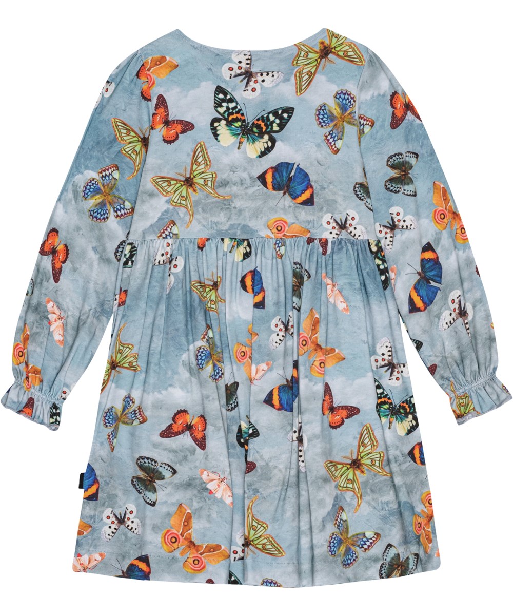 Camie - Les Papillons - Ruimvallende blauwe jersey jurk van biologische katoen met een all-over vlinderprint