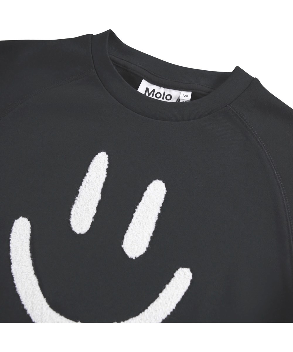 Carola - Black - Lange zwarte sweaterjurk met lange mouwen gemaakt van geborsteld biologisch katoen.