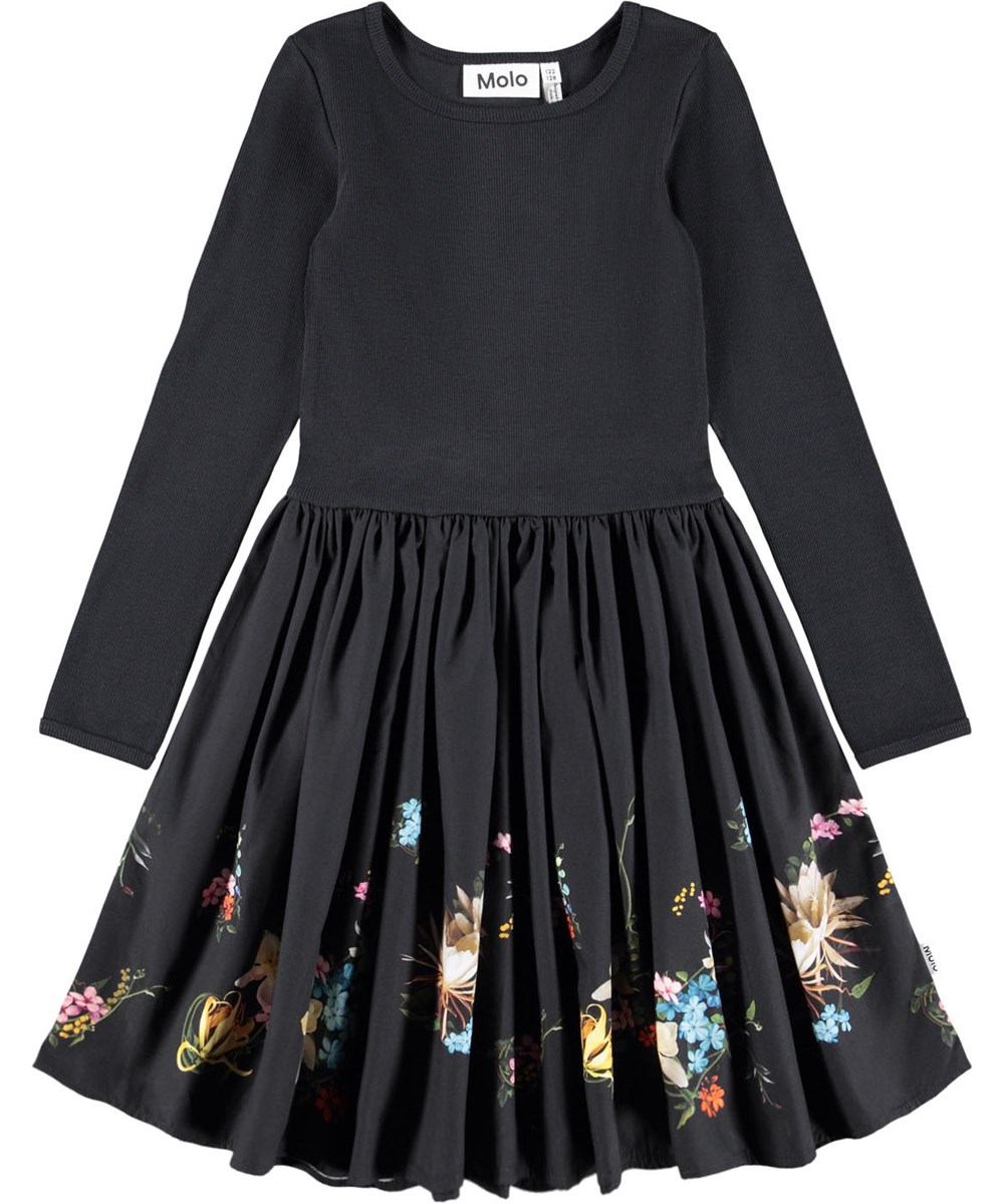 Casie - Paisley Border - Lange zwarte kinderjurk gemaakt van biologisch katoen met lange mouwen, een popeline rok en een bloemenprint.