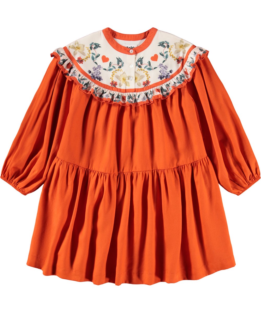 Cibbe - Alpine Flora - Oranje knielange kinderjurk gemaakt van viscose met een bloemenprint op het lijfje.