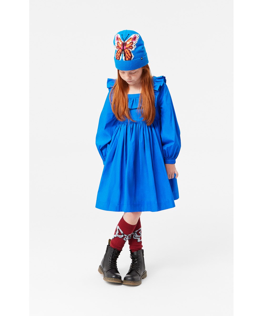 Cillie - Lapis Blue - Blauwe knielange jurk van biologisch katoen met een vierkante hals en een ruchesrand.