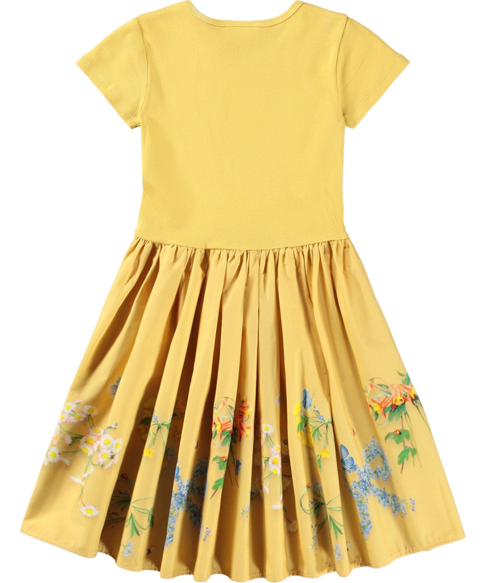 Cissa - Dressy Bows - Gele kinderjurk met een bloemenprint gemaakt van biologisch katoen 