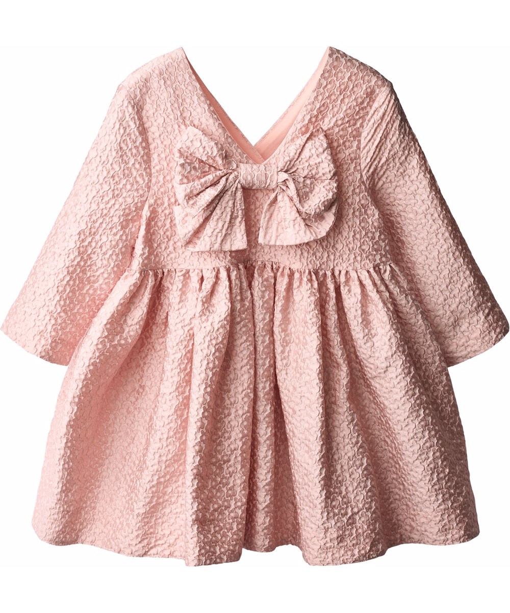 Coco - Foxglove Light - Volumineuze roze kinderjurk in een jacquard bloemenpatroon met een grote strik aan de achterkant.