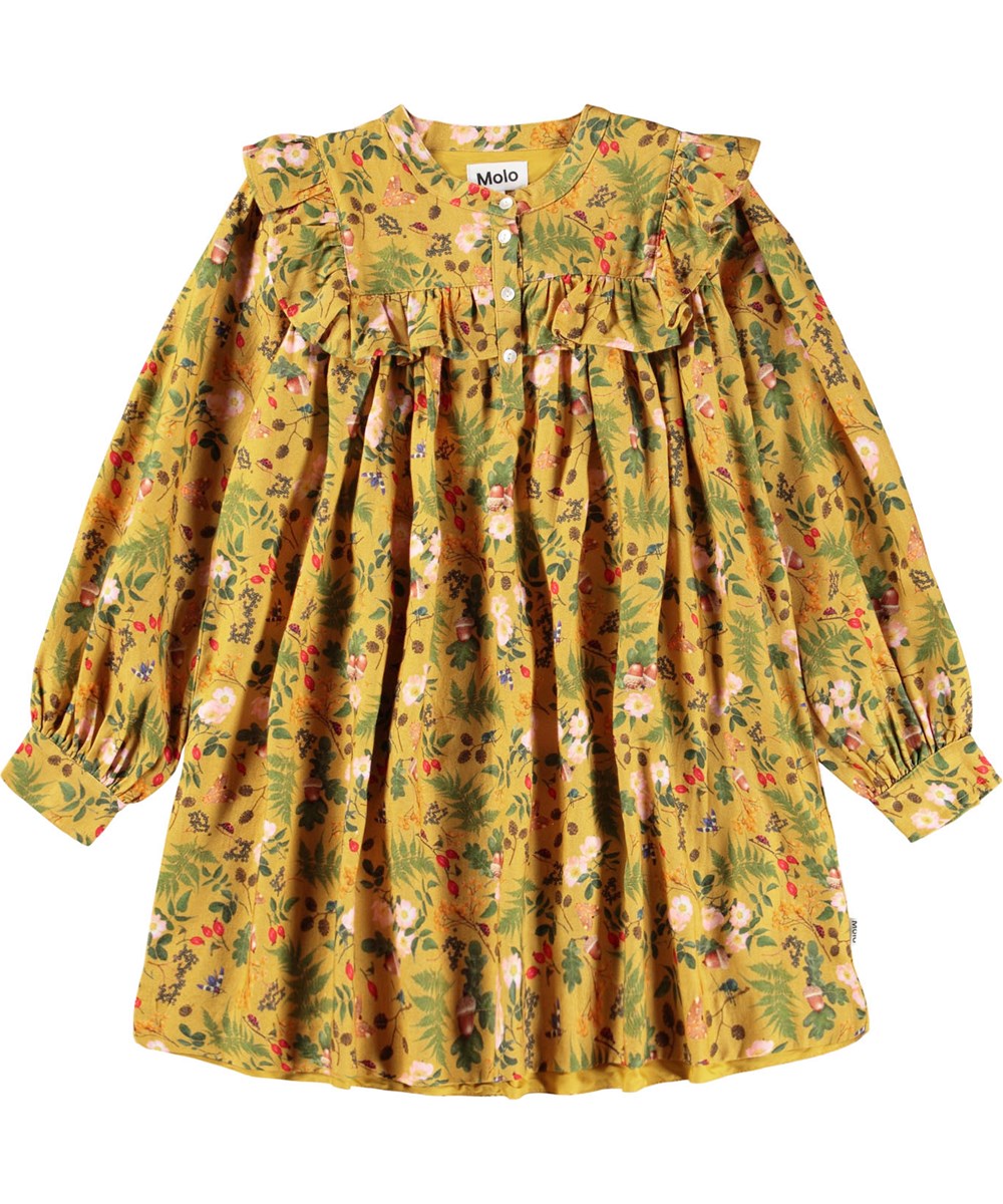 Constance - Foraging - Lange gele kinderjurk met lange mouwen met ruches en een print van bladeren, bloemen en noten.