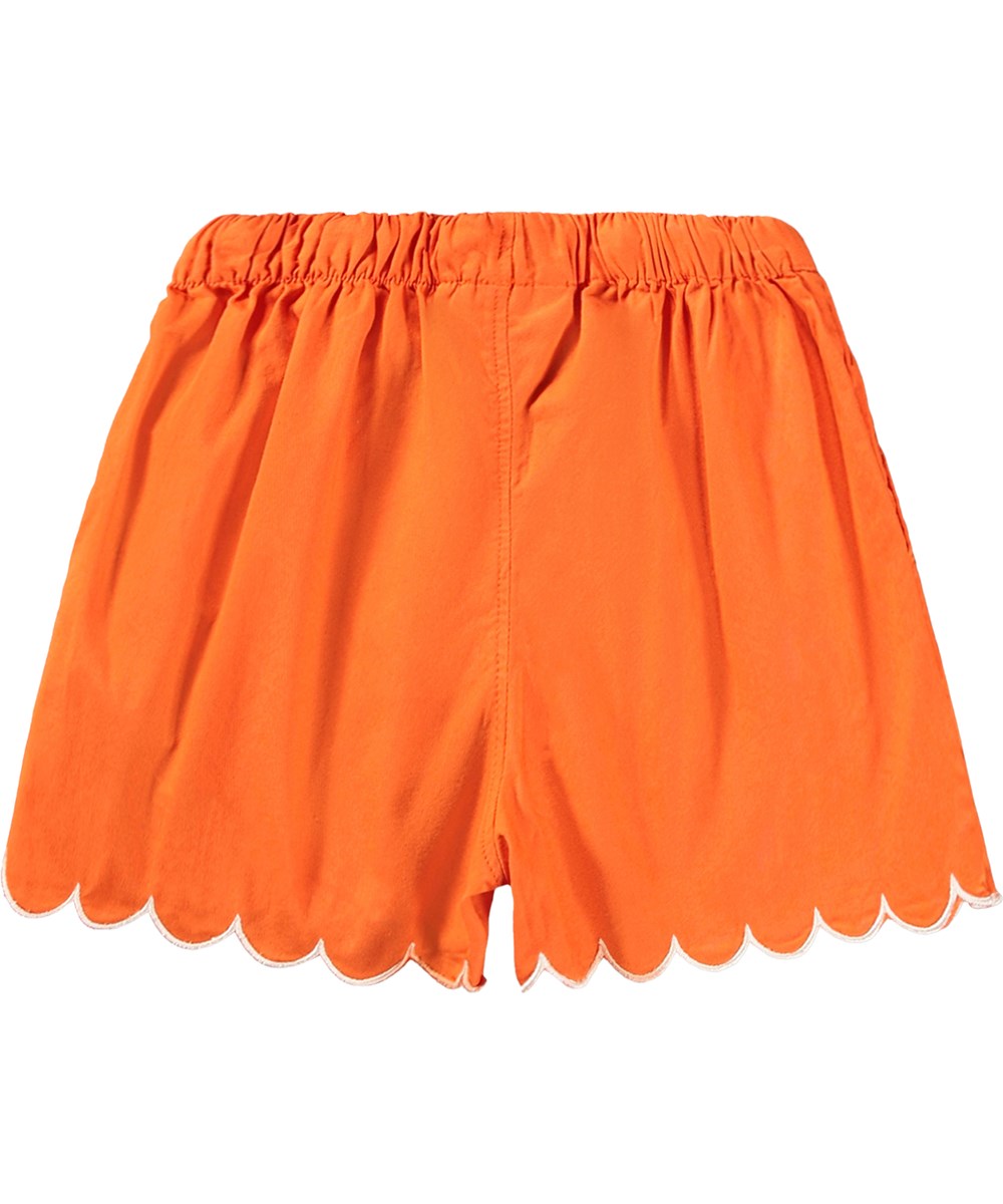 Addie - Love - Oranje kindershorts met golvende randen gemaakt van biologisch katoen 