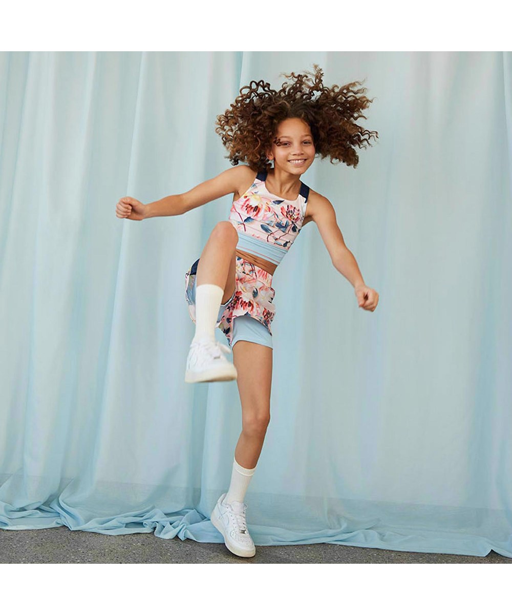 Omari - Motion Flower - Lichtgekleurde sportbroek in twee lagen met bloemenmotief