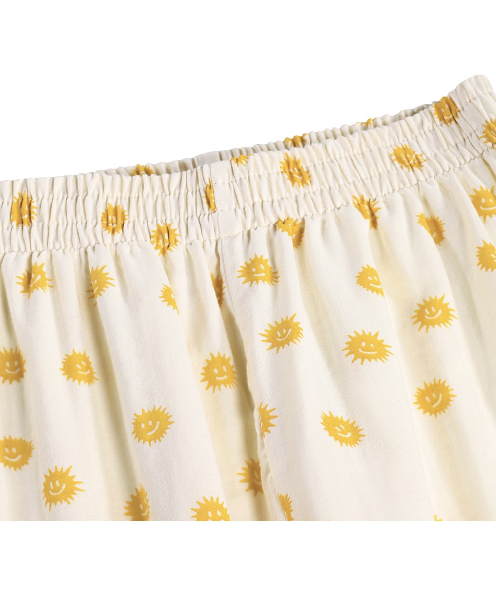 Lin - Sunshine Night - Gebroken witte kinderpyjama met een print gemaakt van biologisch katoen 