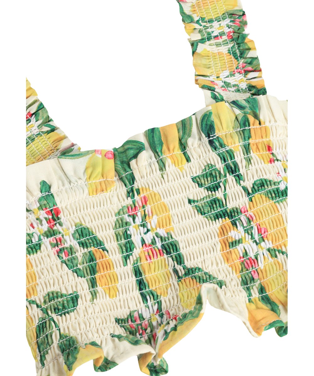 Rolfia - Citrus - Gele crop top voor kinderen met smockeffect en print.