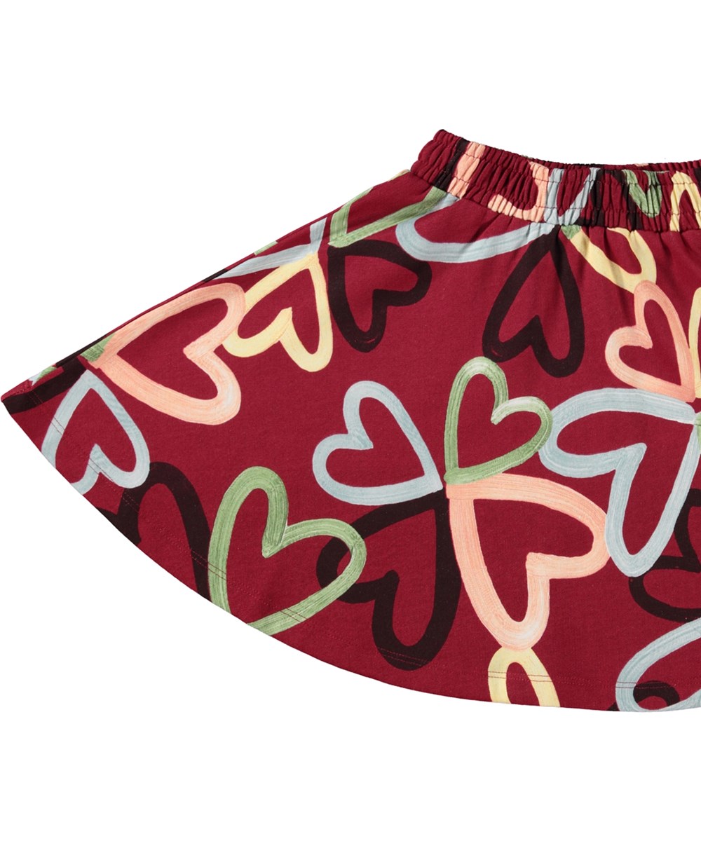 Barbera - Flutters Of Love - Comfortabele rode biologische katoenen rok met elastische tailleband en een all-over hartjesprint.