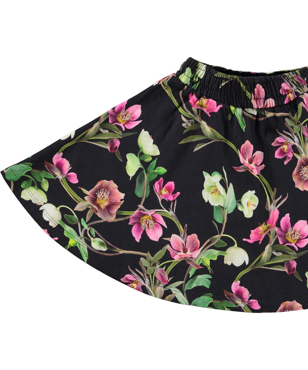 Barbera - Hellebore Black - Comfortabele zwarte biologische katoenen rok met elastische tailleband en een all-over bloemenprint.