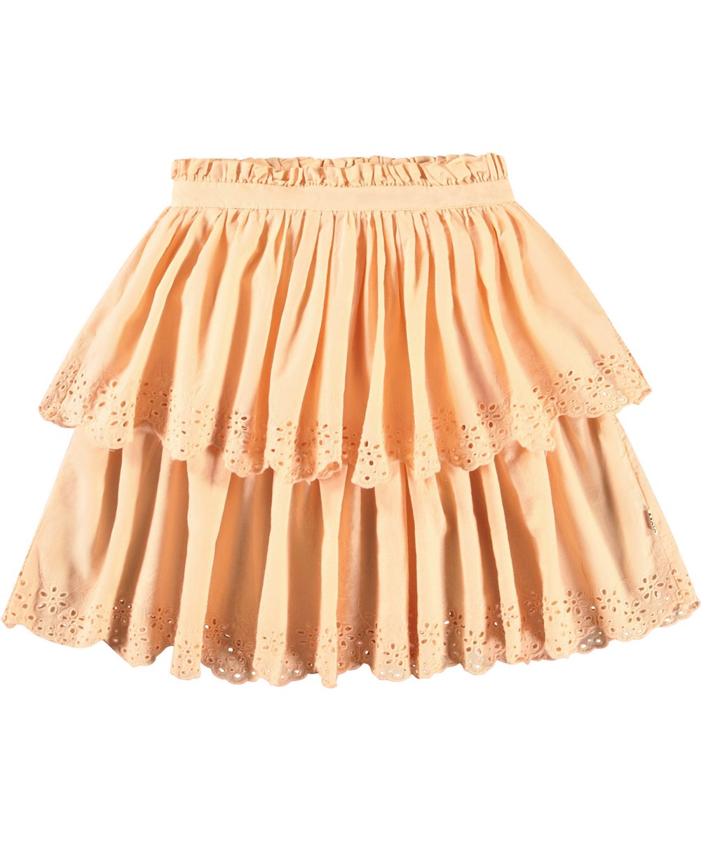 Brianna - Pale Melon - Lichtoranje kinderrok van biologisch katoen. De rok valt op de knie en heeft twee lagen in verschillende lengtes met Engels kant aan de boord.