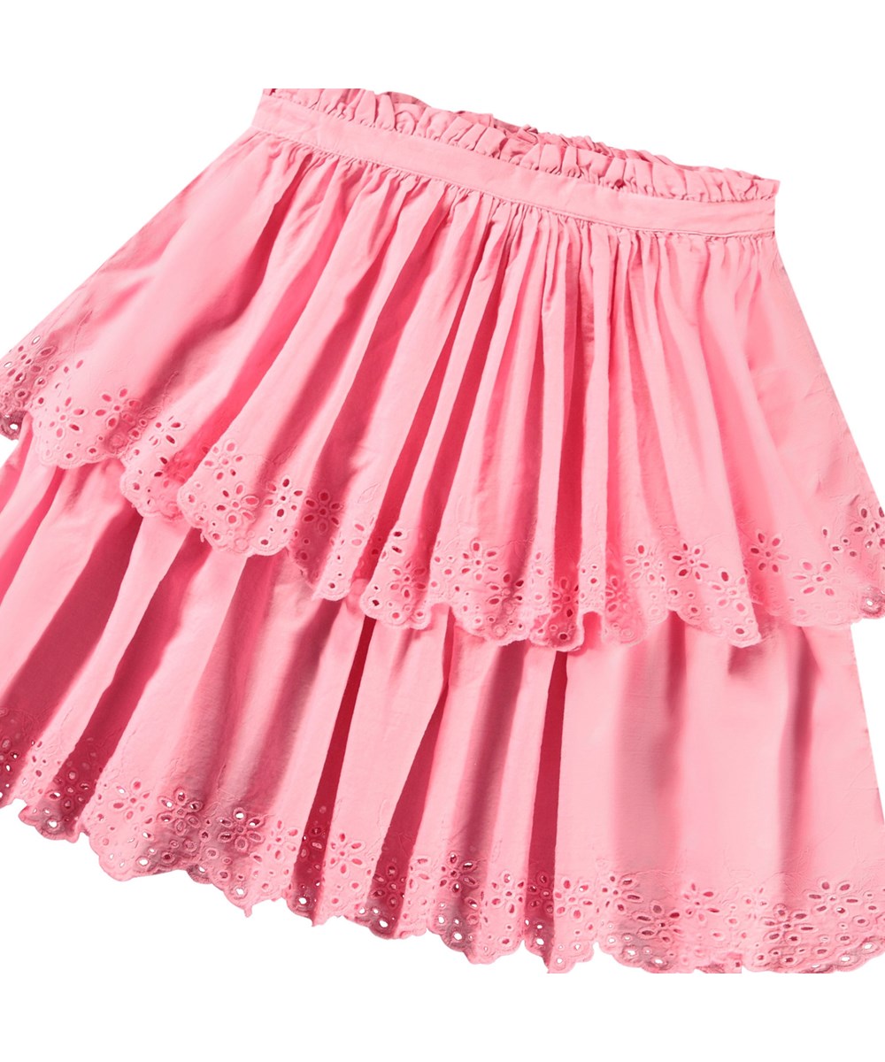 Brianna - Pink Lemonade - Roze kinderrok van biologisch katoen. De rok valt op de knie en heeft twee lagen in verschillende lengtes met Engels kant aan de boord.