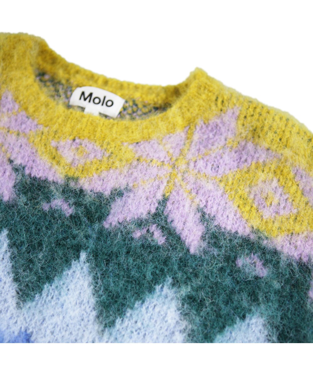 Glenda - Grande Nordic - Gebreide kindertrui gemaakt van een alpacawolmix met een grafische print in meerdere kleuren.