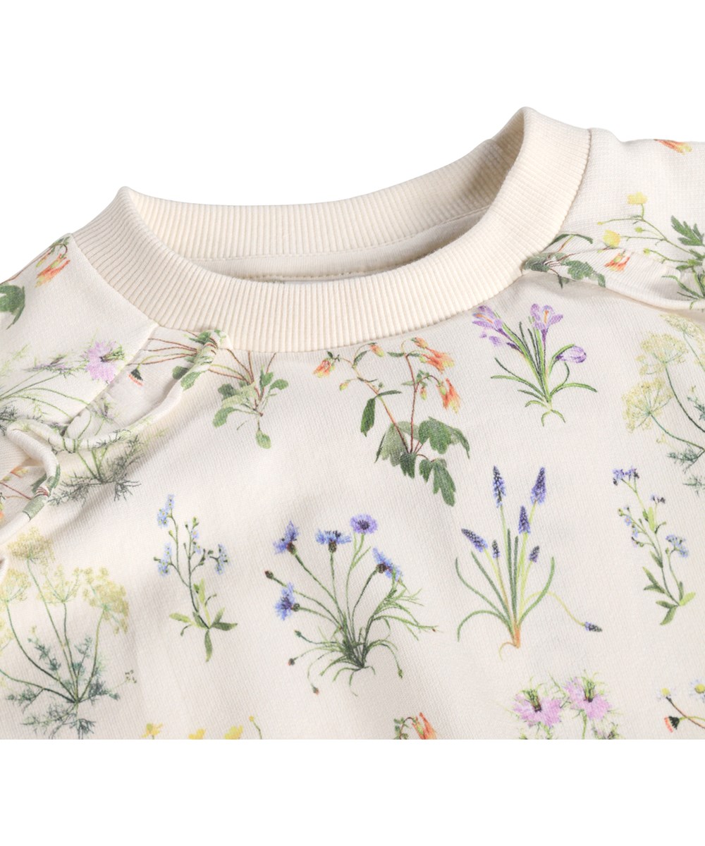 Mabel - Primavera - Beige kindersweater met een bloemenprint gemaakt van biologisch katoen 