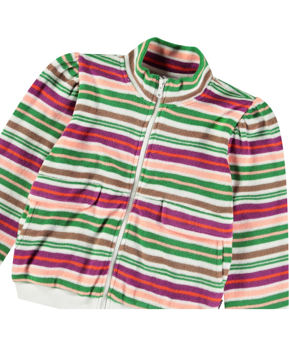 Malika - Exotic Stripe - Bolche gestreepte badstoffen kindervest vest met ritssluiting, steekzakken met zakflap, plooitjes op de schouder en een brede ribboord rond de mouwen en onderkant.