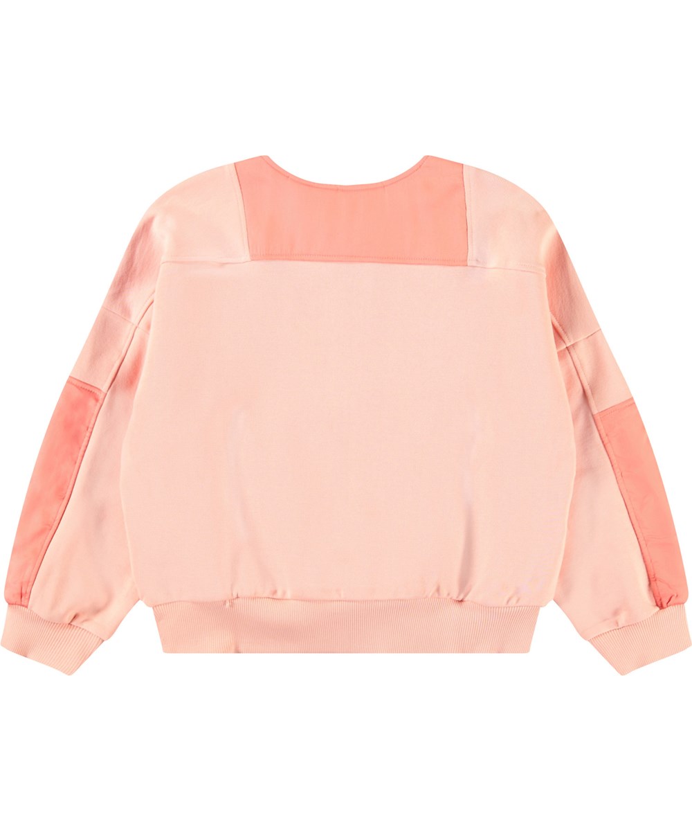 Malissa - Peach - Lichtoranje kindersweater van zacht biologisch katoen met ribboord rond de mouwen en onderkant alsmede een rits aan de voorkant.