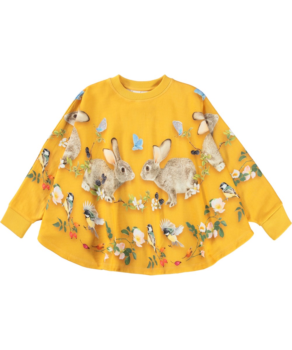 Marcella - In The Woods - Gele biologische poncho sweater met een konijn en vogelprint
