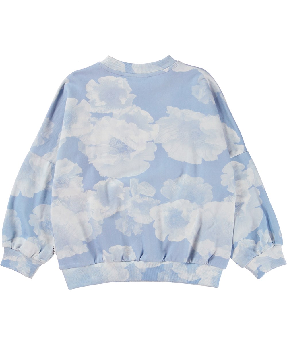 Marika - Cloudy Poppies - Blauwe biologische trui met wolken en luchtprint