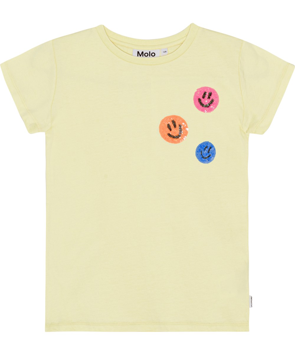 Ranva - Pale Dawn - Pastelgele t-shirt van biologisch katoen met op de borst drie kleine geborduurde smiley's van pailletten 