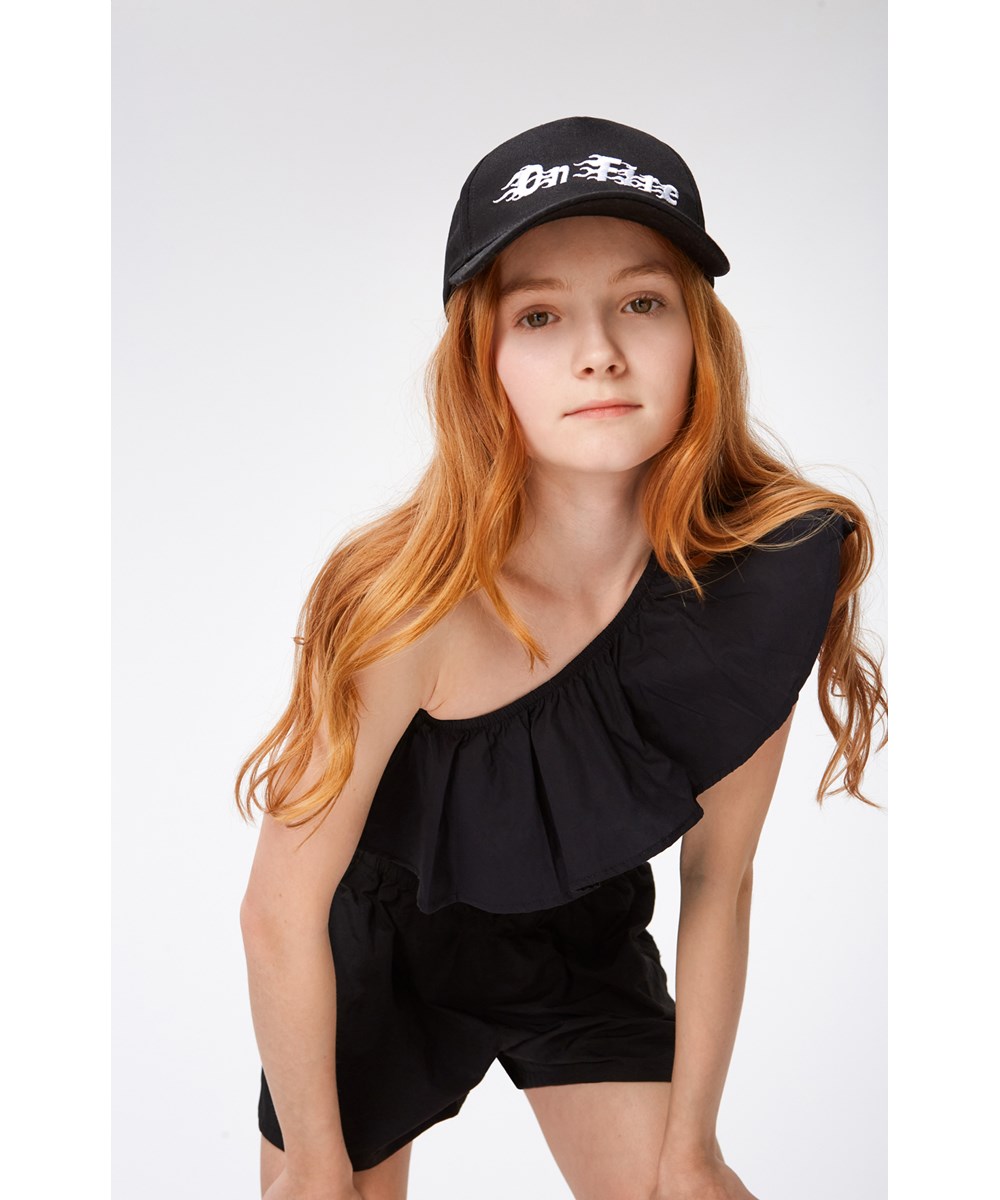 Rebecca - Black - Zwarte one shoulder top van biologische katoen met stretch