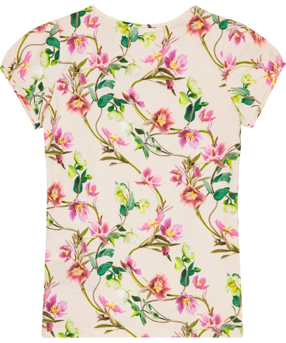Rimona - Hellebore - T-shirt van biologisch katoen met korte pofmouwen en een witte en lichtroze print over de hele stof.