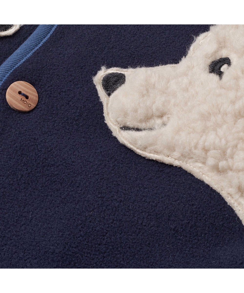 Uli - Dark Night - Dunkelblaue und cremefarbene Fleecejacke für Babys und Kleinkinder.