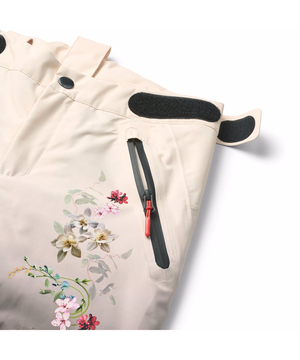 Jump Pro - Faded Paisley - Wind- und wasserdichte Skihose für Kinder mit einem Druck von bunten Blumen, die zum hellen und dunklen Farbverlauf im Hintergrund passen. Sie besteht aus recyceltem Polyester und ist mit 3M™ Thinsulate™ gefüttert.