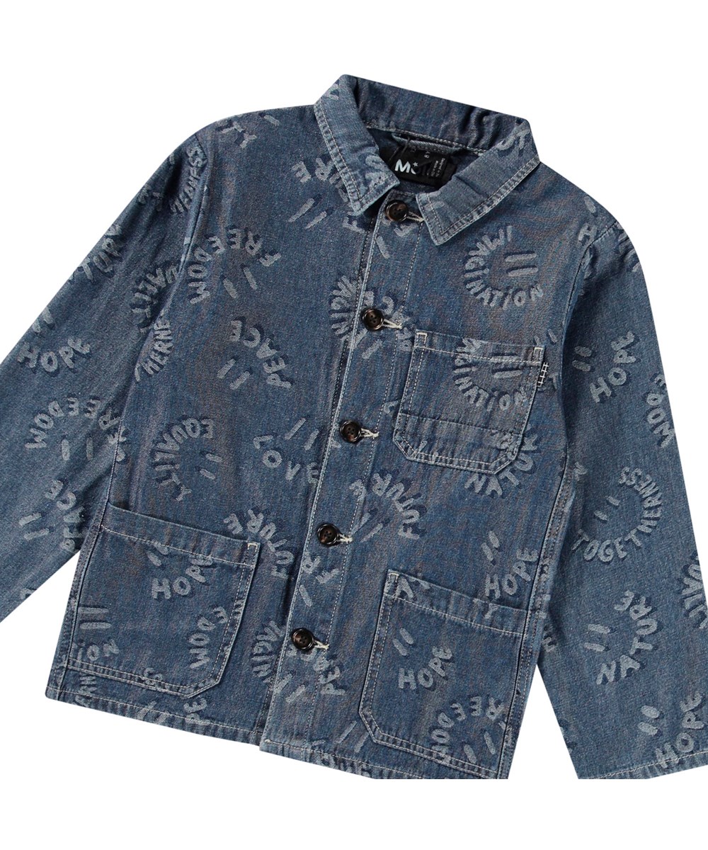 Halley - Word Smiles - Blaue Jeansjacke für Kinder aus weicher Baumwolle mit einem schönen Jacquardmuster, das lächelnde Gesichter und positive Worte wie Mund zeigt.