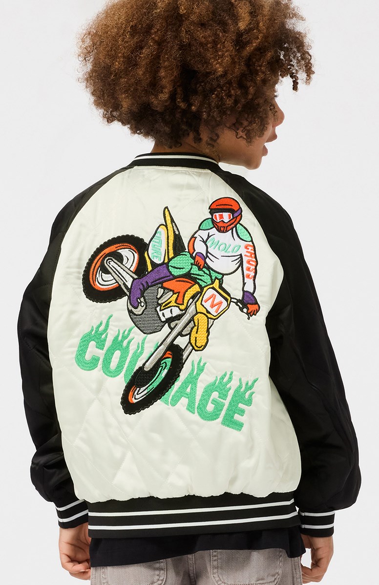 Haru - Molo-Cross - Gesteppte Bomberjacke für Kinder in Schwarz und Off-White mit einem bestickten Rückenpatch eines Motocross-Fahrers und dem Text "Courage".
