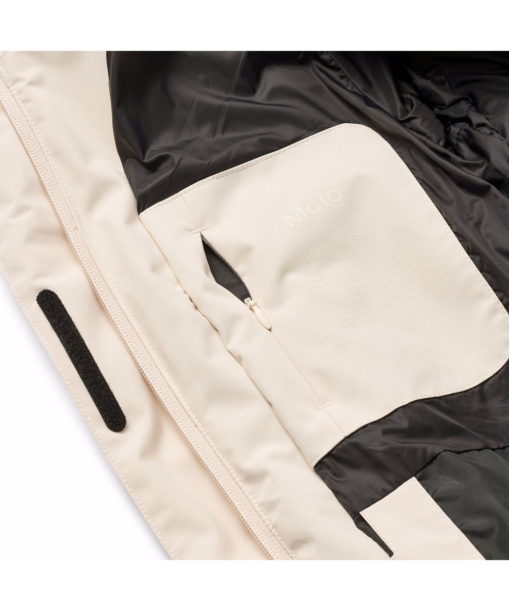 Hansine Pro - Vanilla - Wind- und wasserabweisende Winterjacke in Off-White für Kinder aus recyceltem Polyester mit recycelter Polyesterfüllung und 3M™ Thinsulate™.