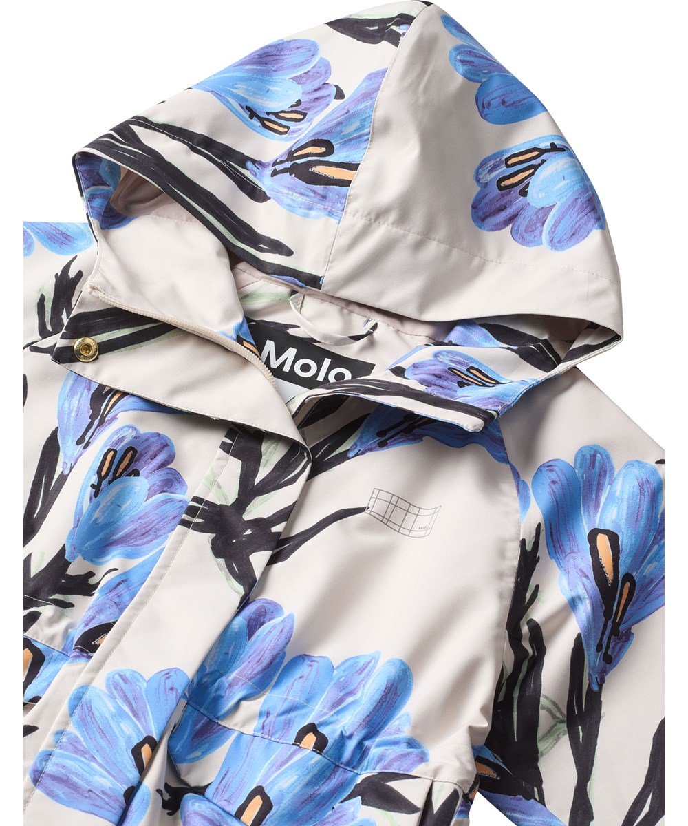 Hennah - Painted Crocus - Sandfarbene, wind- und wasserabweisende gesteppte Baumwolljacke für Kinder mit weichem Rippstrick am Hals und an den Ärmeln.