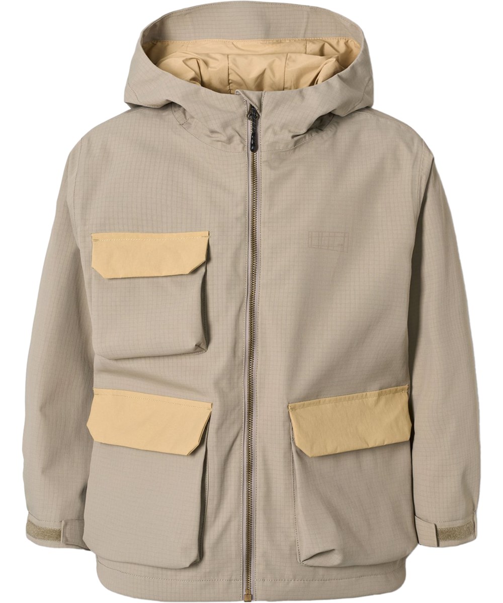 Hobson - Clay - Sandfarbene Funktionsjacke für Kinder, die wind- und wasserdicht ist und aus recyceltem Nylon besteht.