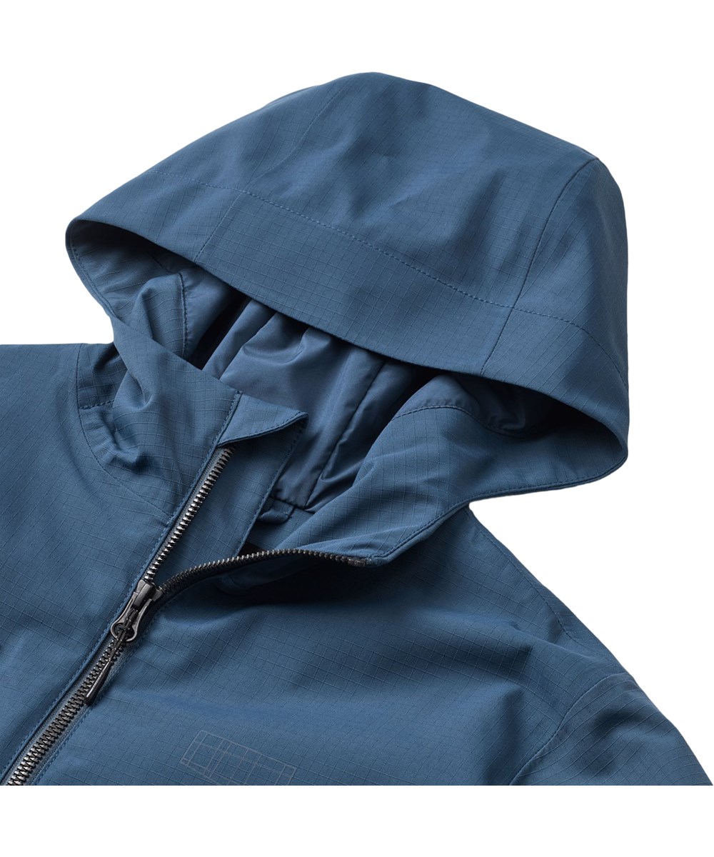 Hobson - Oceanica - Dunkelblaue Funktionsjacke für Kinder, die wind- und wasserdicht ist und aus recyceltem Nylon besteht.