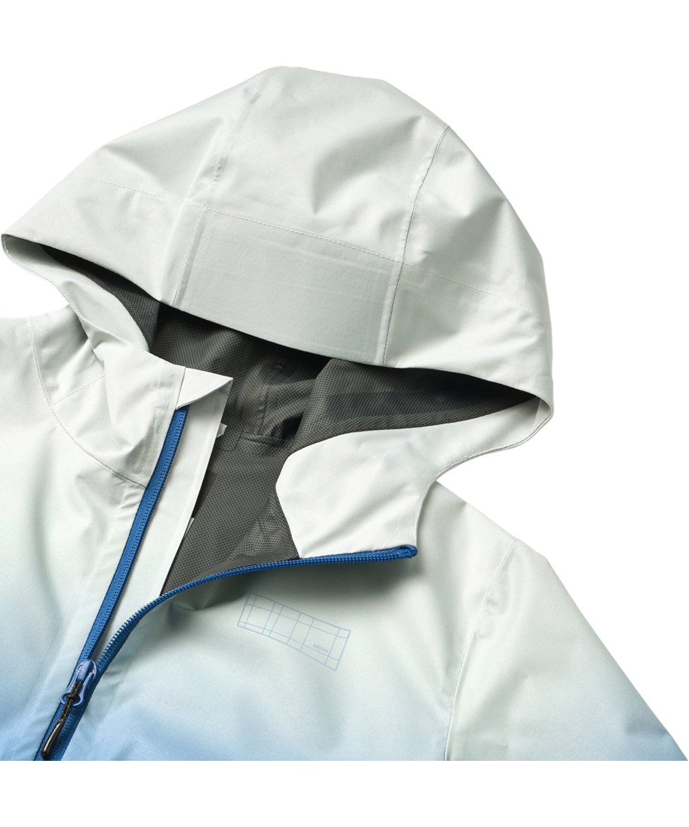 Horizon - Faded Tide - Blaue wind- und wasserdichte Kinderjacke mit Kapuze und laminiertem Innenfutter aus recyceltem Polyester.