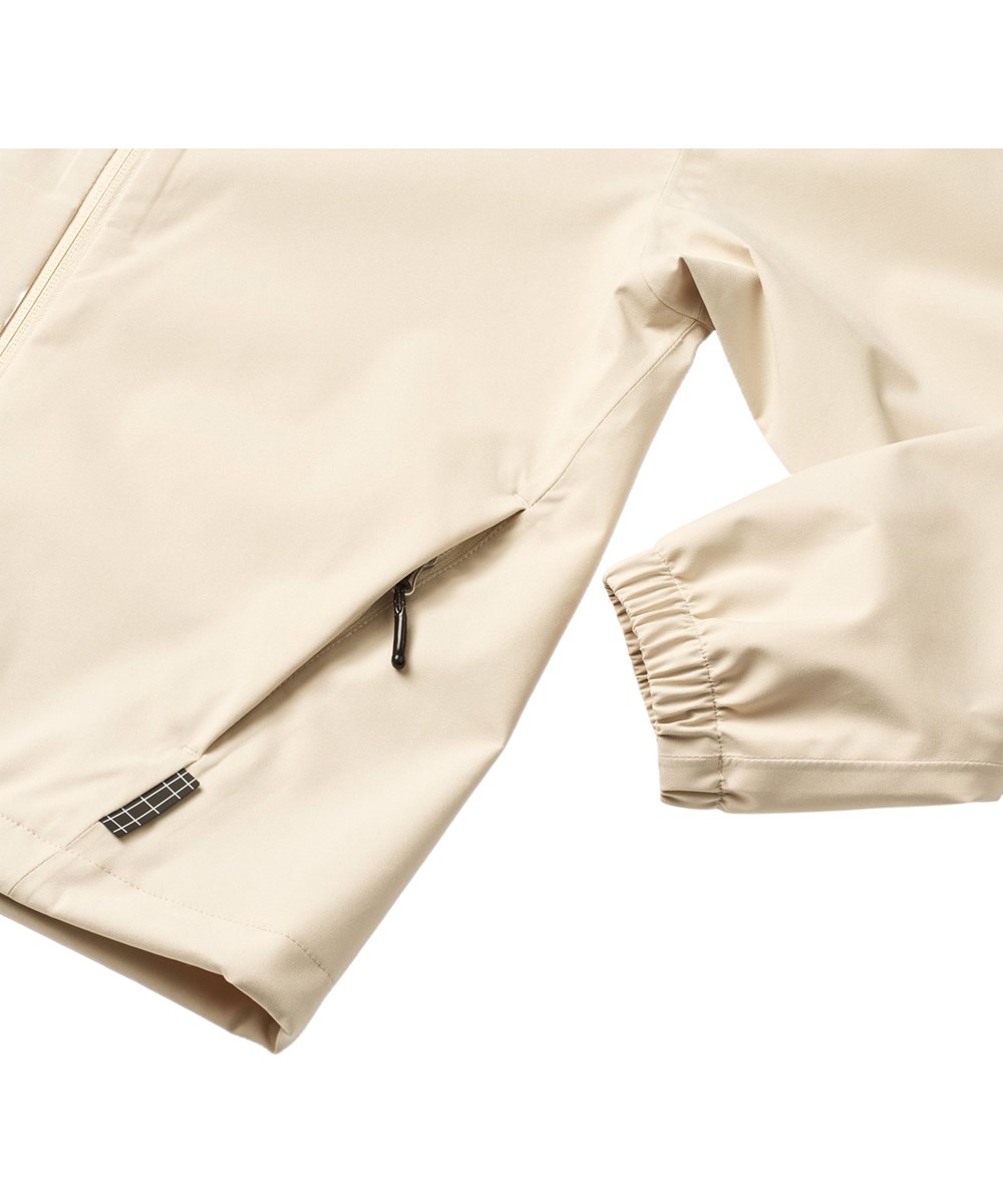Horizon - Summer Sand - Lila und beige wind- und wasserdichte Jacke für Kinder mit Kapuze und laminiertem Innenfutter aus recyceltem Polyester.