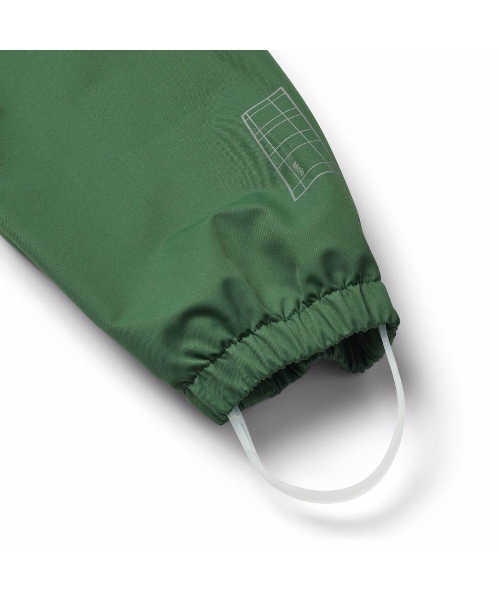Waits - Rubber Tree - Grüne wind- und wasserdichte Regenhosen für Kinder aus strapazierfähigem und recyceltem Polyester.