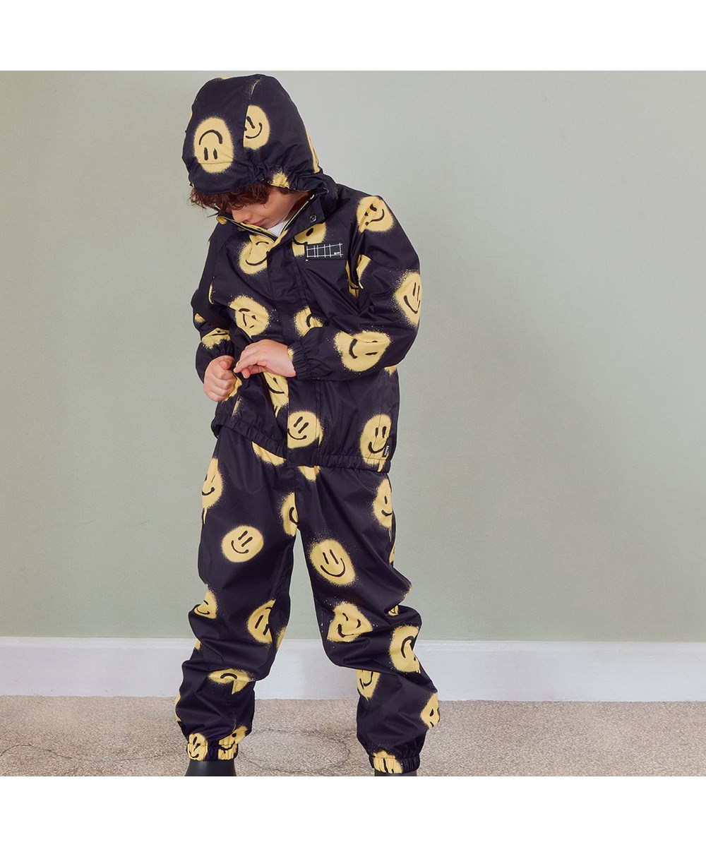 Whalley - Happy! - Leichtes und atmungsaktives Regenset in Schwarz mit Smiley-Print
