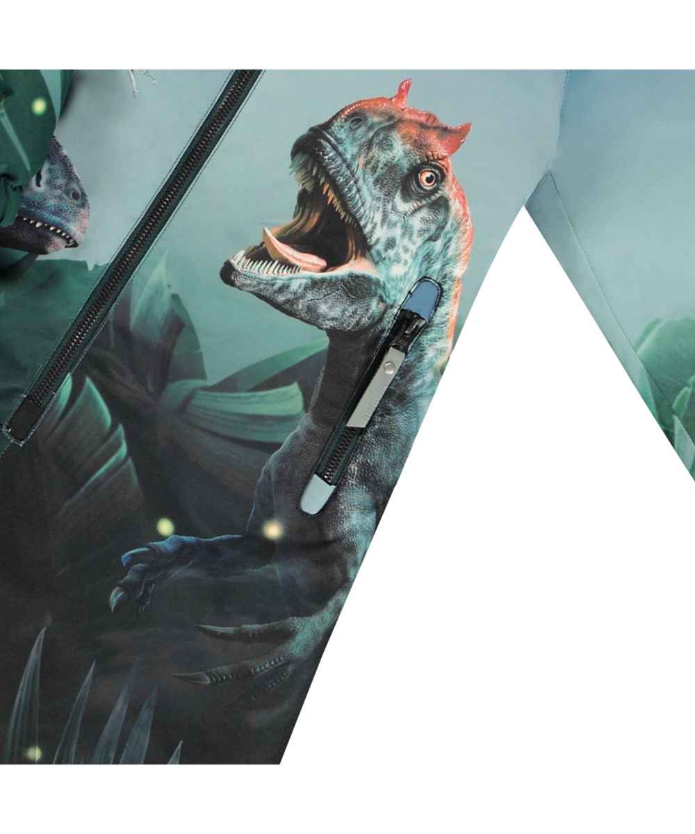 Polar - Amazing Dino - Kinder-Schneeanzug in Blau und Grün aus recyceltem Polyester mit Dinosaurier-Print.