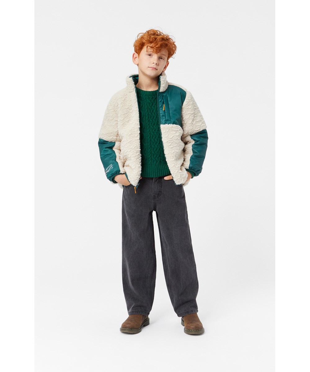 Ugo - Ponderosa Pine - Reversible fleece jacket for children in dark green and off-white.