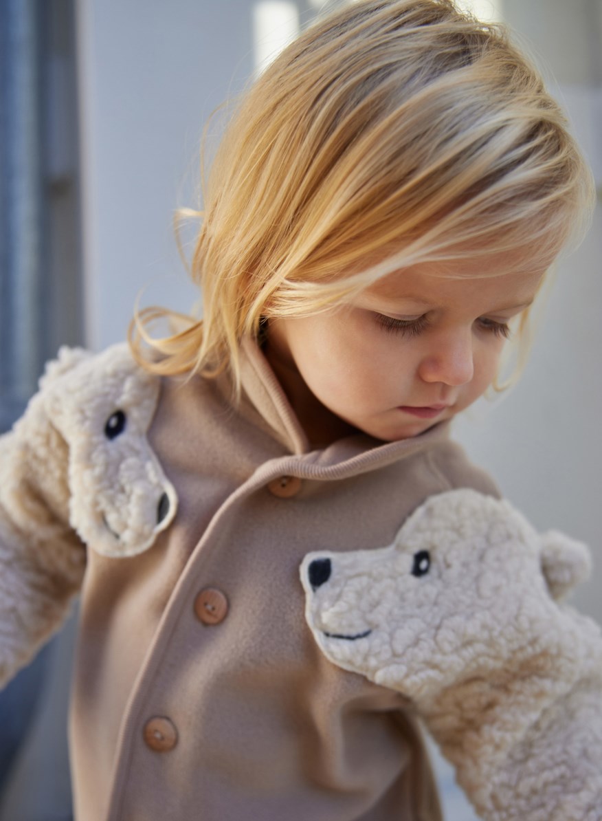 Uli - Mocha - Beige and off-white fleece jacket for babies and toddlers.