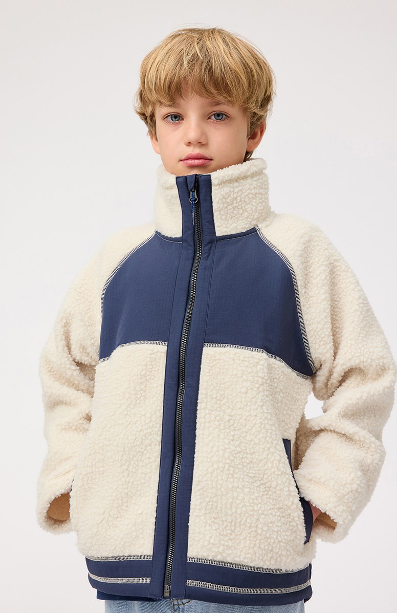 Usher - Summer Sand - Off-white fleece jacket for children in recycled polyester with front pockets and blue durable details.