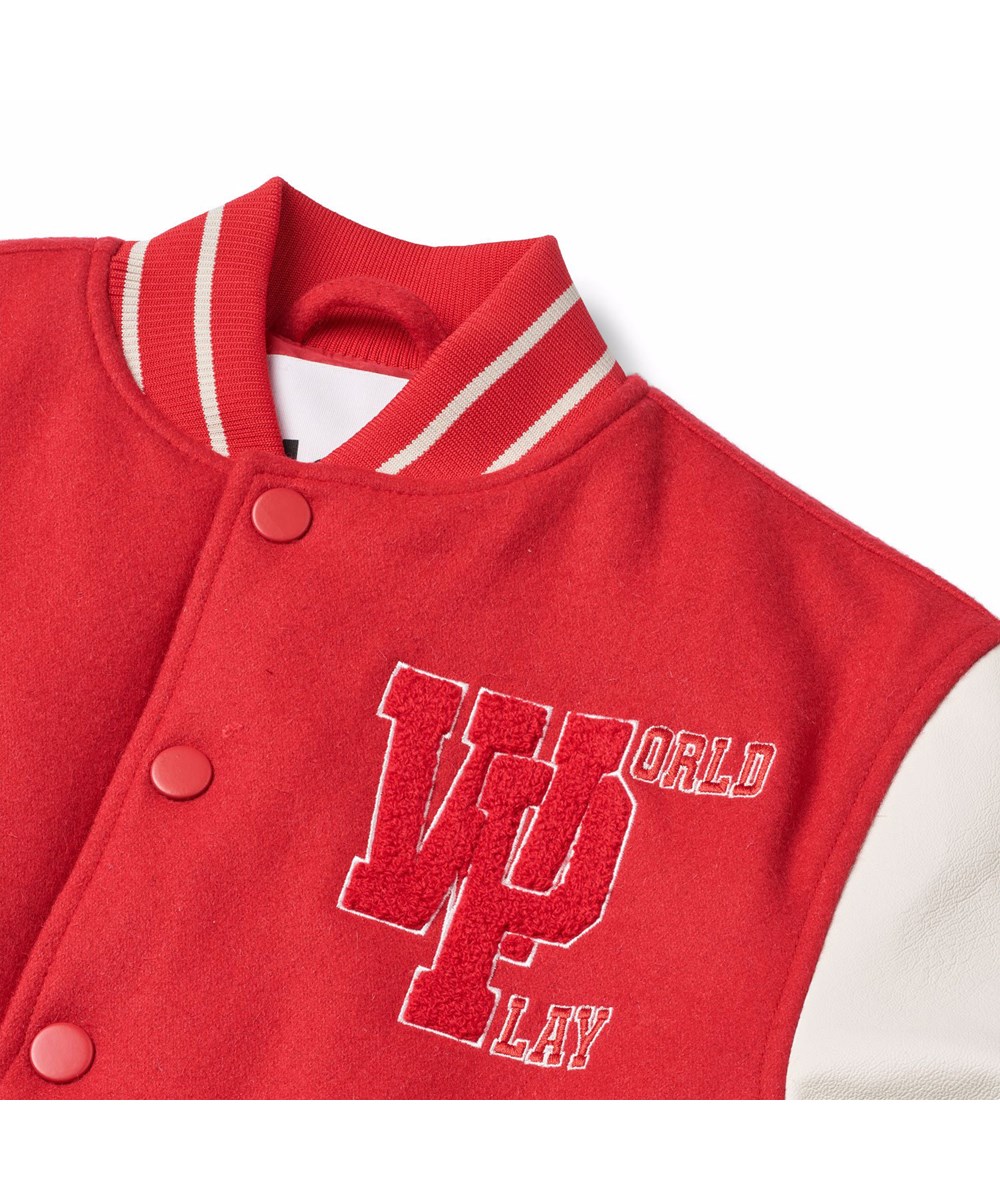 Hani - Adrenaline Rush - Children's red baseball jacket with white sleeves.