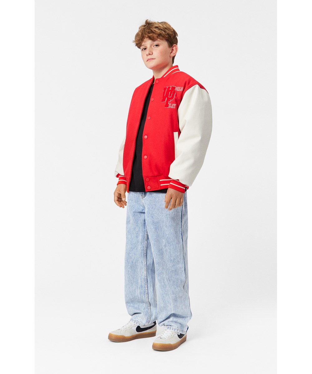 Hani - Adrenaline Rush - Children's red baseball jacket with white sleeves.