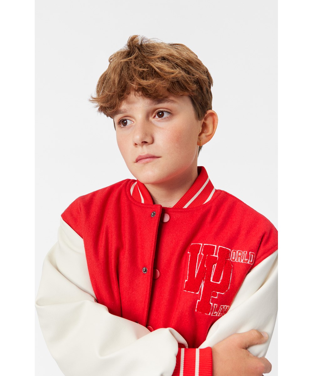 Hani - Adrenaline Rush - Children's red baseball jacket with white sleeves.