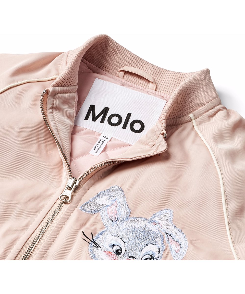 Hatty - Stay Pawsitive - Bomber jacket in pink with an embroidered back patch of a cute dog and the text "Stay pawsitive".