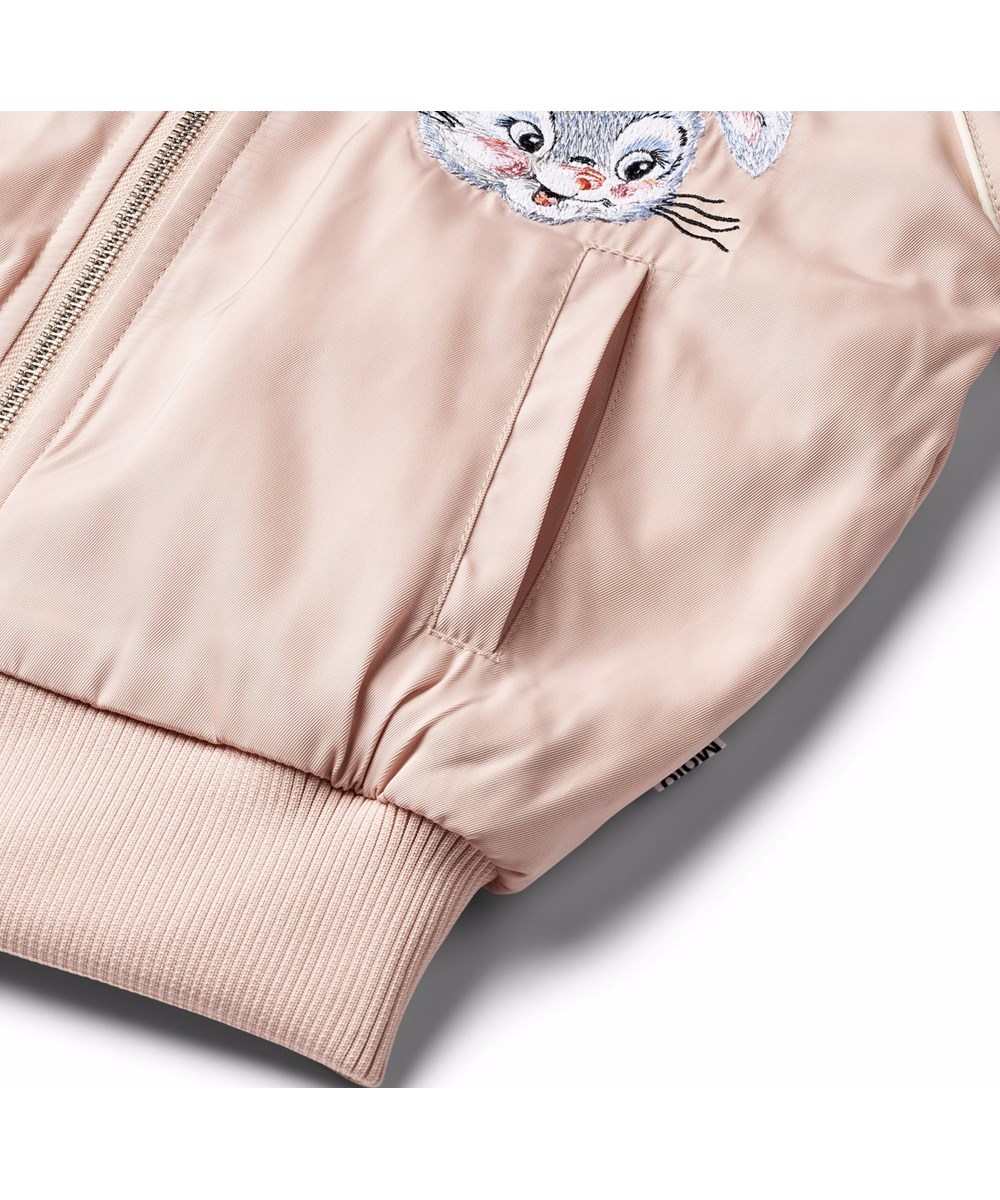 Hatty - Stay Pawsitive - Bomber jacket in pink with an embroidered back patch of a cute dog and the text "Stay pawsitive".